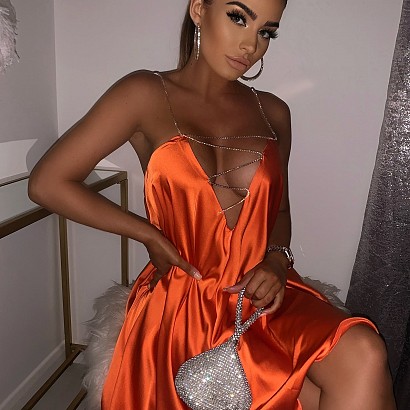 Orange satin low back swing dress with iridescent crystal straps and neck detail